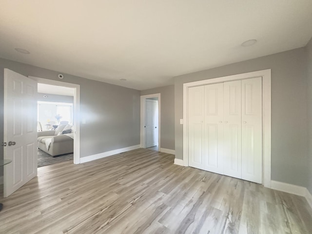 2431 Sandy Hollow Rd, Rockford, IL 61109 - unfurnished bedroom featuring light wood-type flooring and a closet