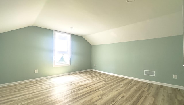 2431 Sandy Hollow Rd, Rockford, IL 61109 - additional living space featuring vaulted ceiling and wood finished floors