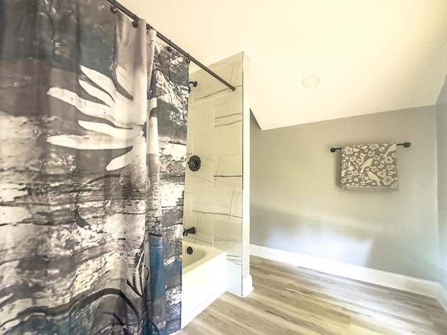 2431 Sandy Hollow Rd, Rockford, IL 61109 - bathroom with shower / tub combo with curtain and wood finished floors