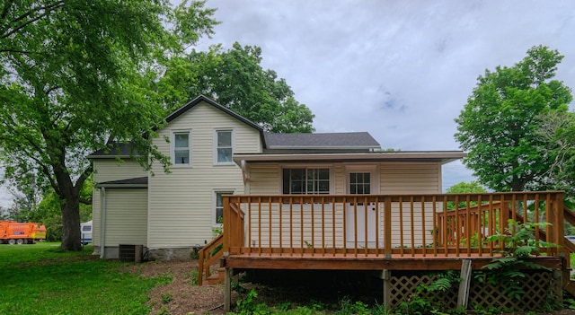 2431 Sandy Hollow Rd, Rockford, IL 61109 - back of property featuring a wooden deck and a shingled roof