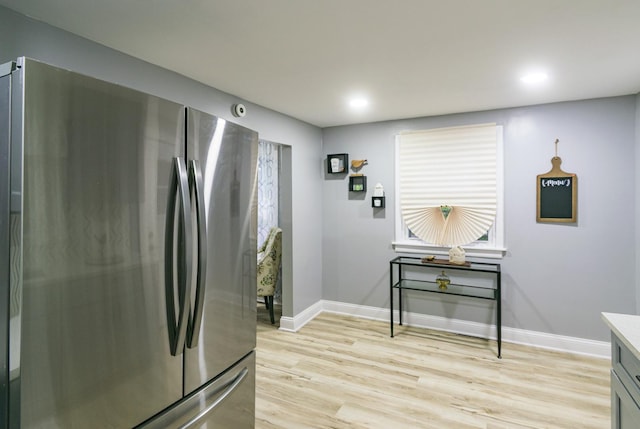 2431 Sandy Hollow Rd, Rockford, IL 61109 - kitchen with freestanding refrigerator, light wood finished floors, light countertops, and recessed lighting