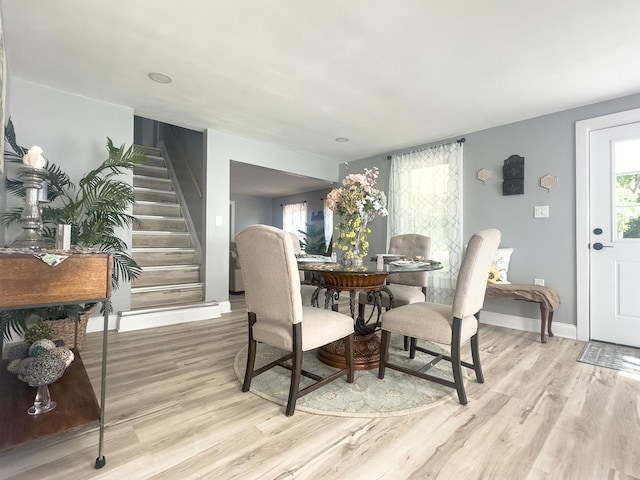 2431 Sandy Hollow Rd, Rockford, IL 61109 - dining room with stairway, light wood-type flooring, and plenty of natural light