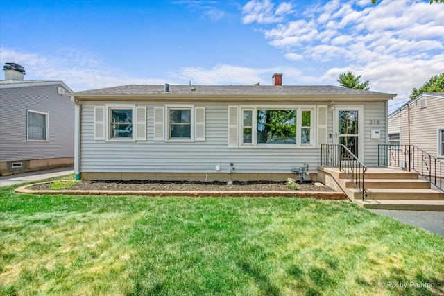 218 N Berteau Ave, Bartlett, IL 60103 - view of front of house with a front yard and a chimney