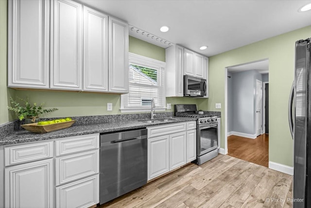 218 N Berteau Ave, Bartlett, IL 60103 - kitchen with stainless steel appliances, white cabinetry, light wood-style flooring, and recessed lighting