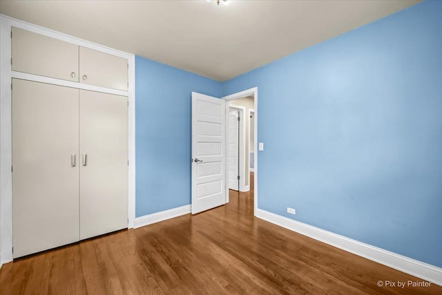 218 N Berteau Ave, Bartlett, IL 60103 - unfurnished bedroom with wood finished floors and a closet