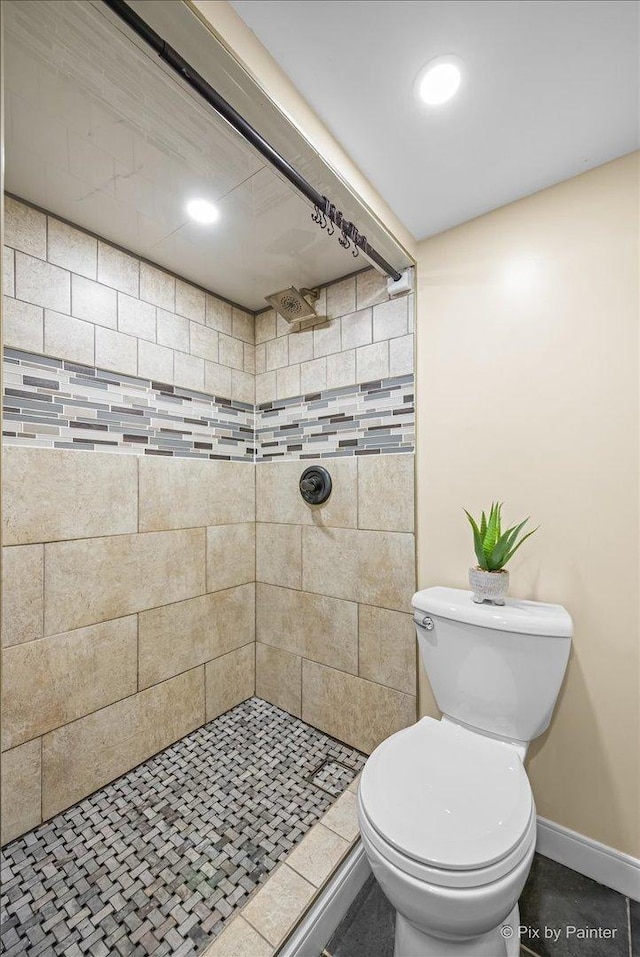 218 N Berteau Ave, Bartlett, IL 60103 - bathroom featuring a tile shower and toilet
