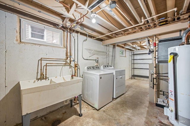 218 N Berteau Ave, Bartlett, IL 60103 - below grade area featuring gas water heater, independent washer and dryer, and healthy amount of natural light