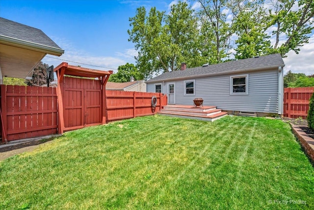 218 N Berteau Ave, Bartlett, IL 60103 - back of house with a fenced backyard and a storage unit
