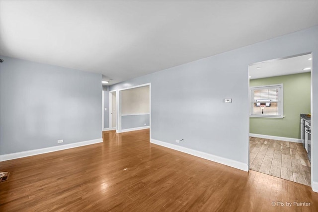 218 N Berteau Ave, Bartlett, IL 60103 - spare room featuring wood finished floors and baseboards