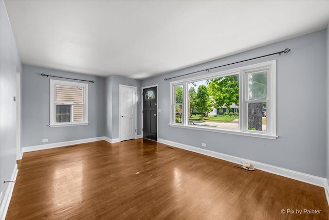 218 N Berteau Ave, Bartlett, IL 60103 - unfurnished room with wood finished floors and baseboards