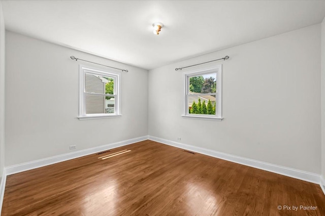 218 N Berteau Ave, Bartlett, IL 60103 - unfurnished room with baseboards and wood finished floors