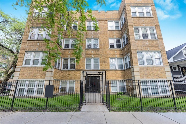 4855 N Springfield Ave Unit 3, Chicago, IL 60625 - view of apartment building / complex with a fenced front yard