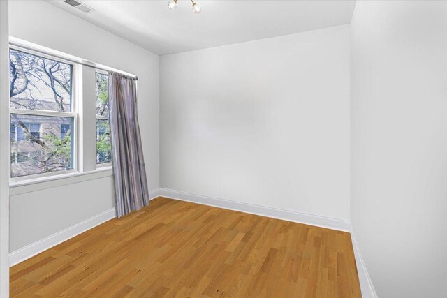 4855 N Springfield Ave Unit 3, Chicago, IL 60625 - empty room featuring light wood-style flooring and baseboards
