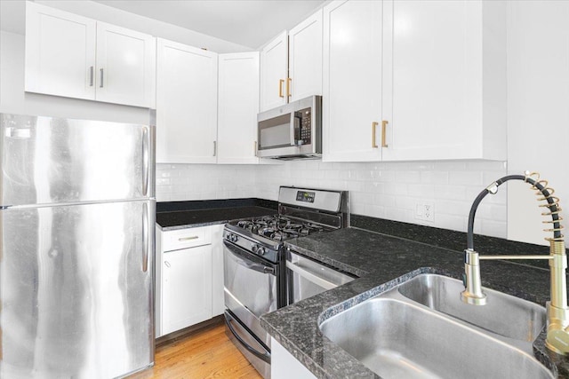 4855 N Springfield Ave Unit 3, Chicago, IL 60625 - kitchen with stainless steel appliances and white cabinetry