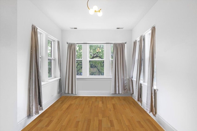 4855 N Springfield Ave Unit 3, Chicago, IL 60625 - empty room with light wood-style flooring and baseboards