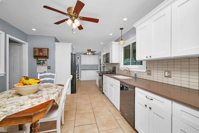 2503 Little Rock Rd, Plano, IL 60545 - kitchen with black appliances, ceiling fan, backsplash, white cabinetry, and light tile patterned floors