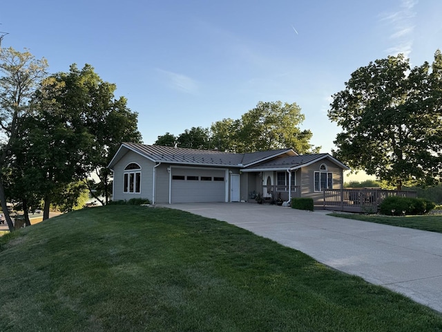 127 S Front St, Hennepin, IL 61327 - ranch-style home featuring an attached garage, a front lawn, and driveway