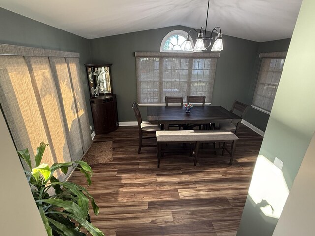 127 S Front St, Hennepin, IL 61327 - dining room featuring lofted ceiling, a chandelier, and wood finished floors