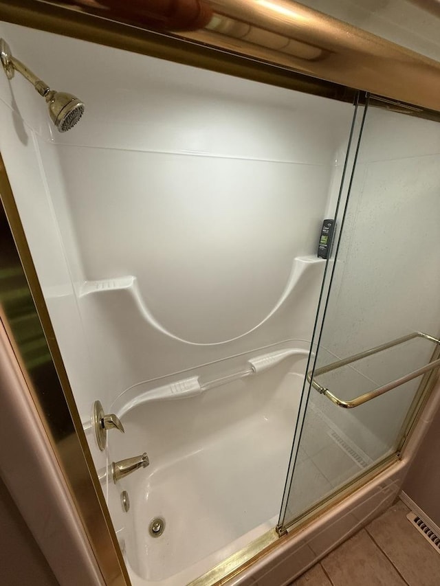 127 S Front St, Hennepin, IL 61327 - full bath with tile patterned flooring and shower / bath combination with glass door