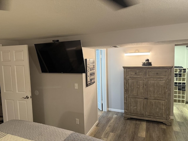 127 S Front St, Hennepin, IL 61327 - bedroom featuring wood finished floors and a textured ceiling