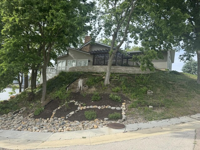 127 S Front St, Hennepin, IL 61327 - view of front of property with a pergola and a chimney