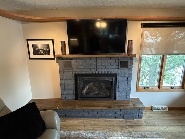 127 S Front St, Hennepin, IL 61327 - detailed view of wood finished floors and a fireplace