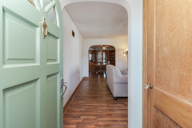 1211 Hovey Ave, Normal, IL 61761 - hall with arched walkways, wood finished floors, and a textured ceiling