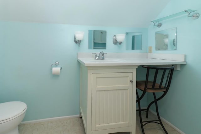 1211 Hovey Ave, Normal, IL 61761 - half bath featuring vanity and vaulted ceiling