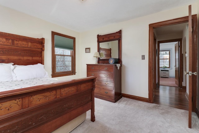 1211 Hovey Ave, Normal, IL 61761 - bedroom featuring light colored carpet and baseboards