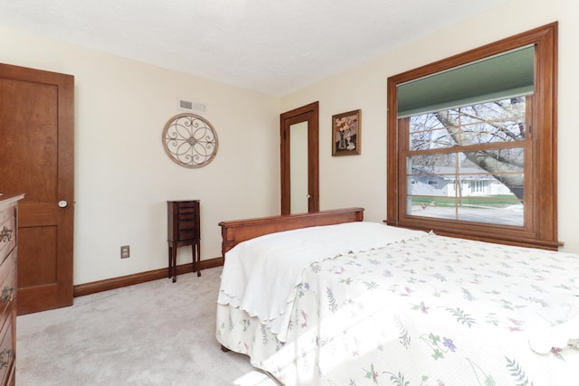 1211 Hovey Ave, Normal, IL 61761 - bedroom with light carpet and baseboards