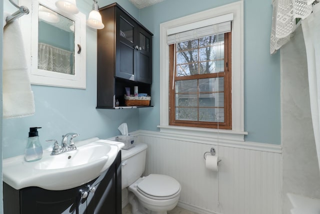 1211 Hovey Ave, Normal, IL 61761 - bathroom featuring a wainscoted wall and vanity