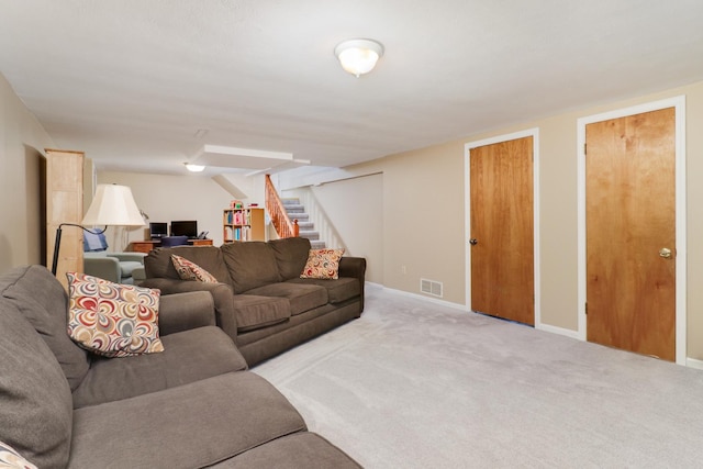 1211 Hovey Ave, Normal, IL 61761 - carpeted living room featuring stairs and baseboards