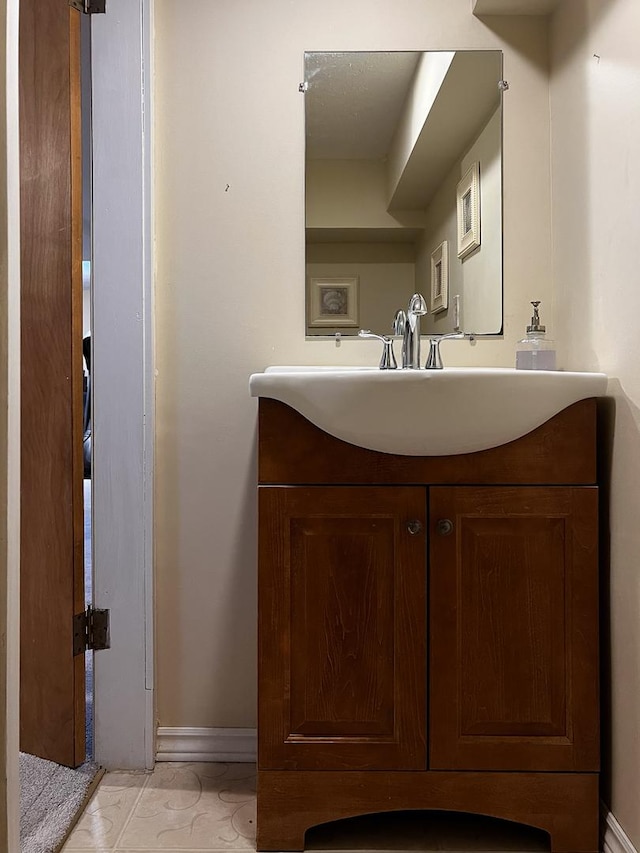1211 Hovey Ave, Normal, IL 61761 - bathroom with vanity and baseboards