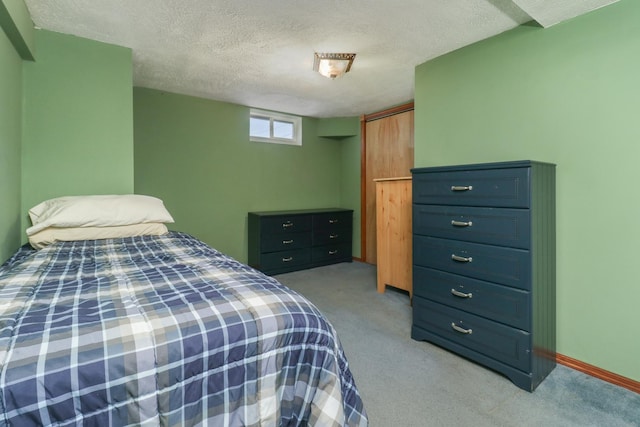 1211 Hovey Ave, Normal, IL 61761 - carpeted bedroom featuring a textured ceiling and a closet