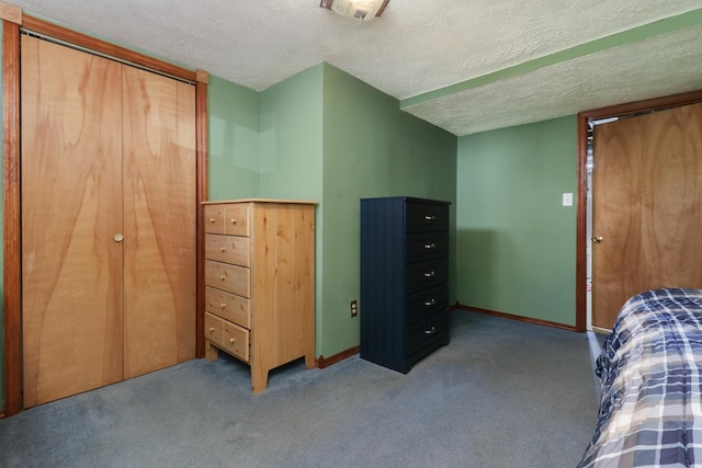 1211 Hovey Ave, Normal, IL 61761 - carpeted bedroom with a textured ceiling and baseboards