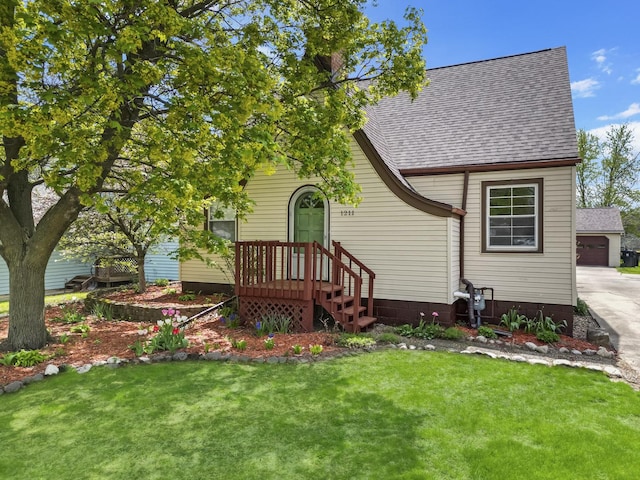 1211 Hovey Ave, Normal, IL 61761 - view of front of home with a shingled roof and a front yard