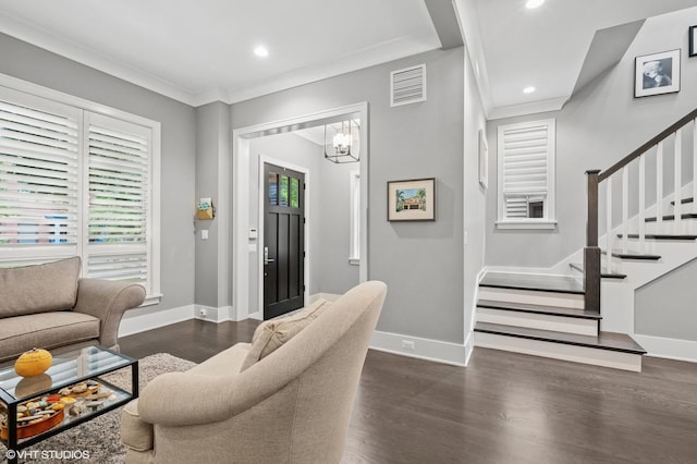 4845 N Leavitt St, Chicago, IL 60625 - living area with dark wood finished floors, stairway, a chandelier, recessed lighting, and ornamental molding