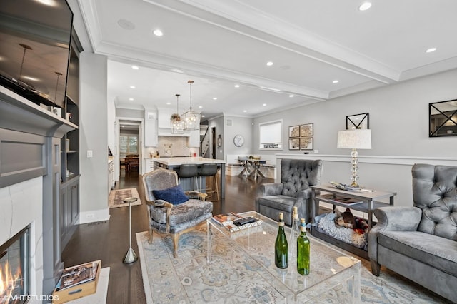 4845 N Leavitt St, Chicago, IL 60625 - living area featuring dark wood-style flooring, recessed lighting, ornamental molding, a chandelier, and beamed ceiling