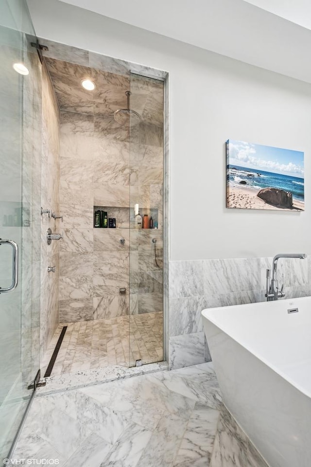 4845 N Leavitt St, Chicago, IL 60625 - full bath featuring a soaking tub, a marble finish shower, tile walls, marble finish flooring, and a wainscoted wall