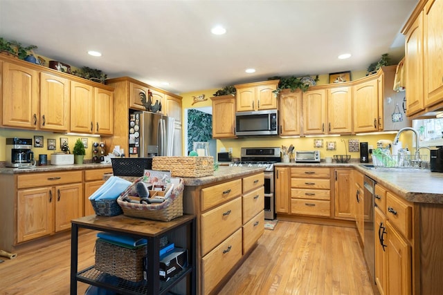 2321 Hayden Way, Normal, IL 61761 - kitchen featuring stainless steel appliances, light wood-type flooring, recessed lighting, and a kitchen island