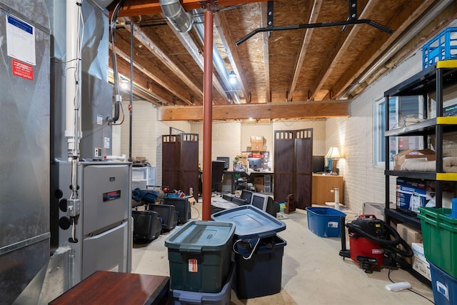 2321 Hayden Way, Normal, IL 61761 - unfinished basement featuring heating unit and brick wall