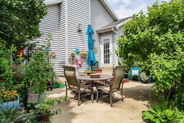2321 Hayden Way, Normal, IL 61761 - view of patio / terrace featuring outdoor dining space and a wall unit AC
