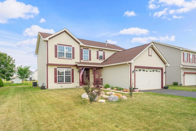 940 Hyte St, Plano, IL 60545 - traditional-style home featuring driveway, a front lawn, an attached garage, and a shingled roof