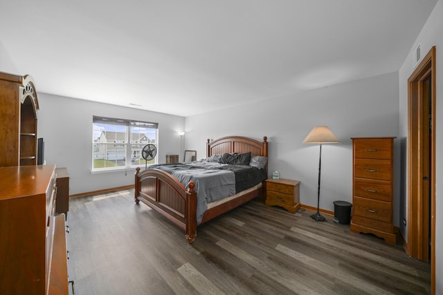 940 Hyte St, Plano, IL 60545 - bedroom featuring dark wood-style floors and baseboards