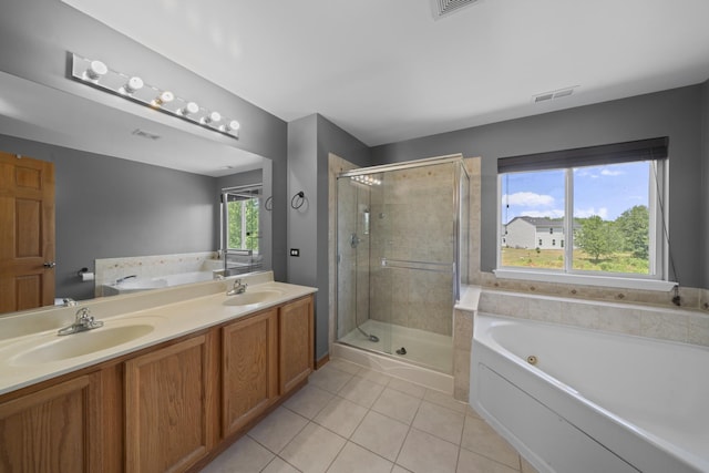 940 Hyte St, Plano, IL 60545 - full bath featuring a garden tub, tile patterned floors, and a stall shower