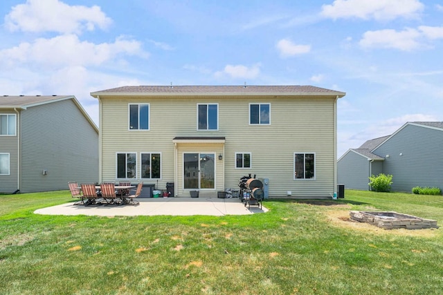 940 Hyte St, Plano, IL 60545 - back of house with a fire pit, a patio area, and a yard