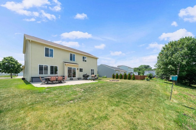 940 Hyte St, Plano, IL 60545 - rear view of house featuring a patio area and a lawn