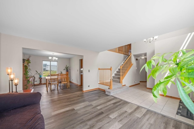 940 Hyte St, Plano, IL 60545 - living area featuring a chandelier, stairs, and wood finished floors