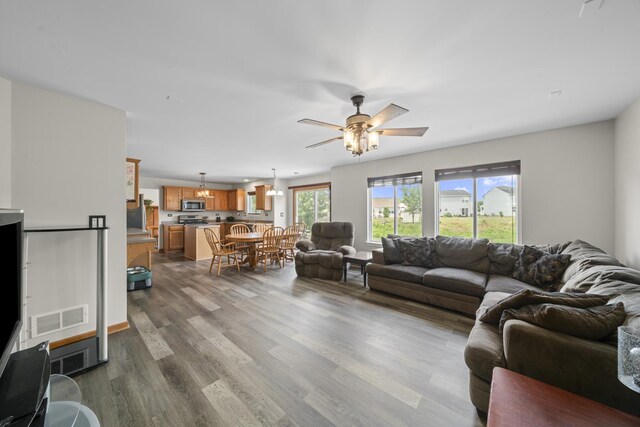 940 Hyte St, Plano, IL 60545 - living area featuring dark wood-type flooring and a ceiling fan