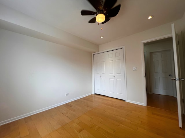 8230 N Elmwood St Unit 405, Skokie, IL 60077 - unfurnished bedroom with light wood-type flooring, a closet, recessed lighting, and a ceiling fan